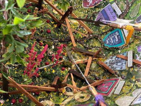 The Tapestry Geode | Interior detail with broken fence, sword, and collar