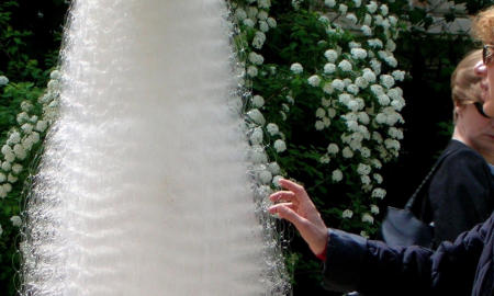 White Cocoon in Parc Monceaux, Paris, being approached by a human being.