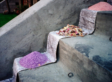 "Procession" | partial view | Installation with painted rice, painted puzzle pieces and scroll on stairs | Two sides, 25 feet each | Chateaux Versailles, Montreal, 1995
